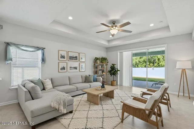 a view of kitchen with furniture and refrigerator