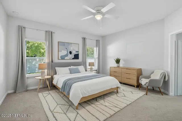 a spacious bathroom with a double vanity sink mirror and bathtub