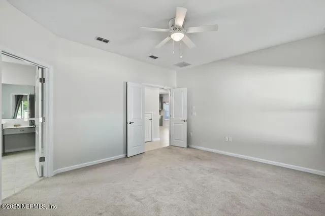 a bathroom with a shower and a sink