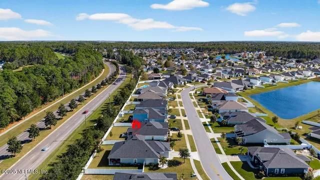 an aerial view of residential houses with outdoor space