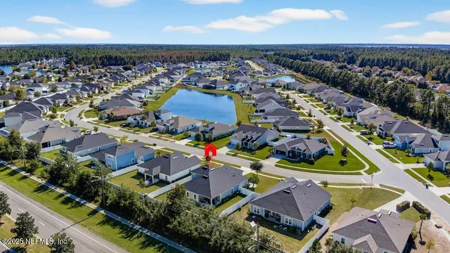 an aerial view of a house with a swimming pool