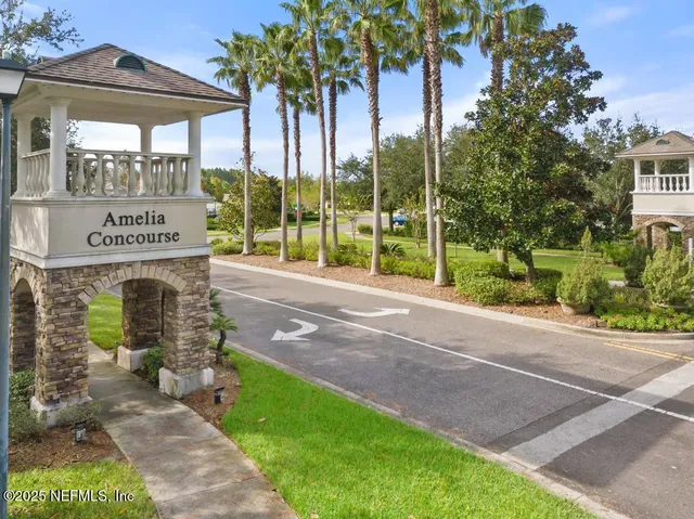 an aerial view of a house with garden space and lake view