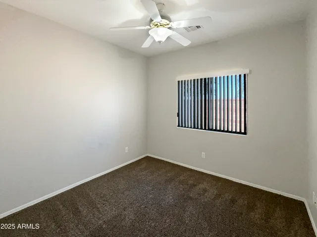 an empty room with a bathroom