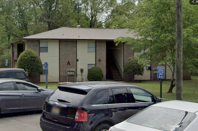 a view of a car parked in front of a house