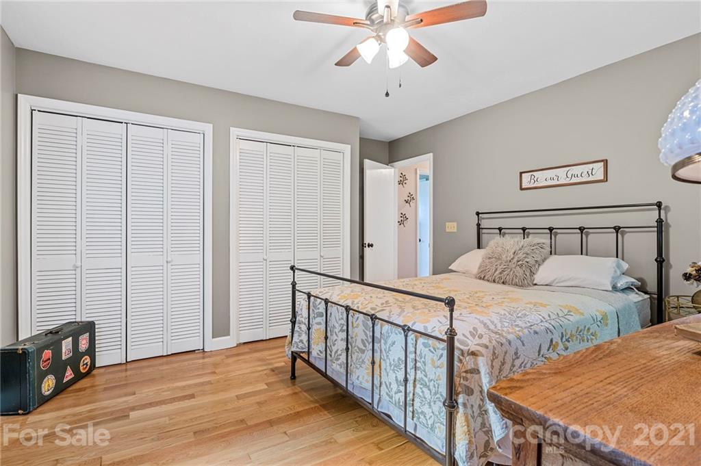 1004 Lickstone Road Waynesville, NC 28786 - Photo 22 of 39 a bedroom with double bed and a window