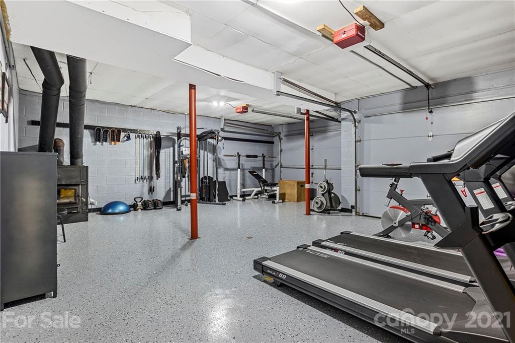 1004 Lickstone Road Waynesville, NC 28786 - Photo 30 of 39 a view of a room with gym equipment