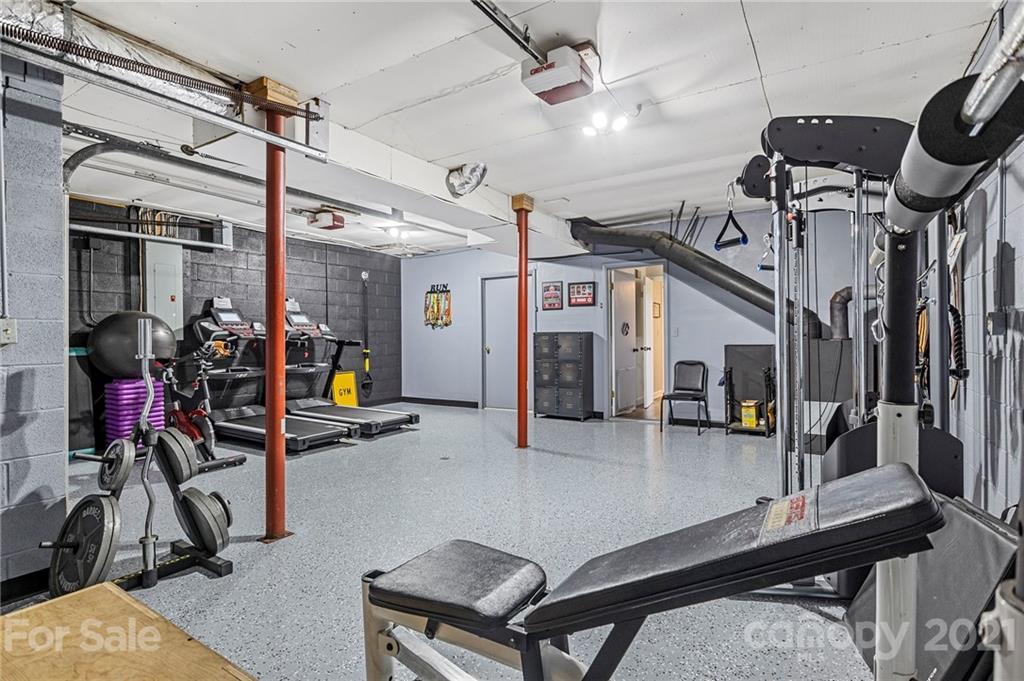 1004 Lickstone Road Waynesville, NC 28786 - Photo 31 of 39 a view of a room with gym equipment
