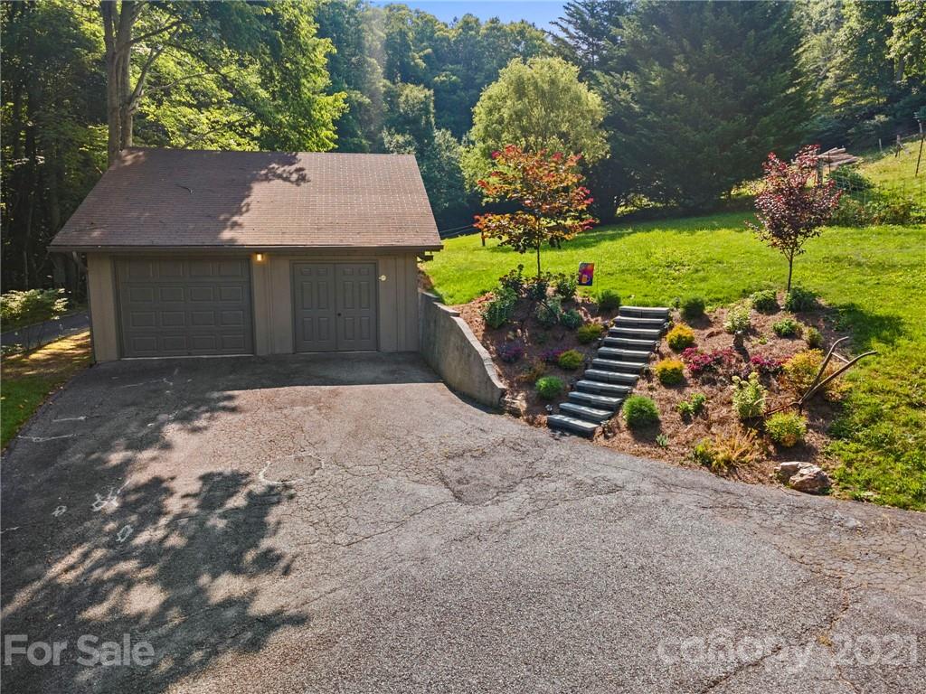 1004 Lickstone Road Waynesville, NC 28786 - Photo 33 of 39 front view of a house with a yard