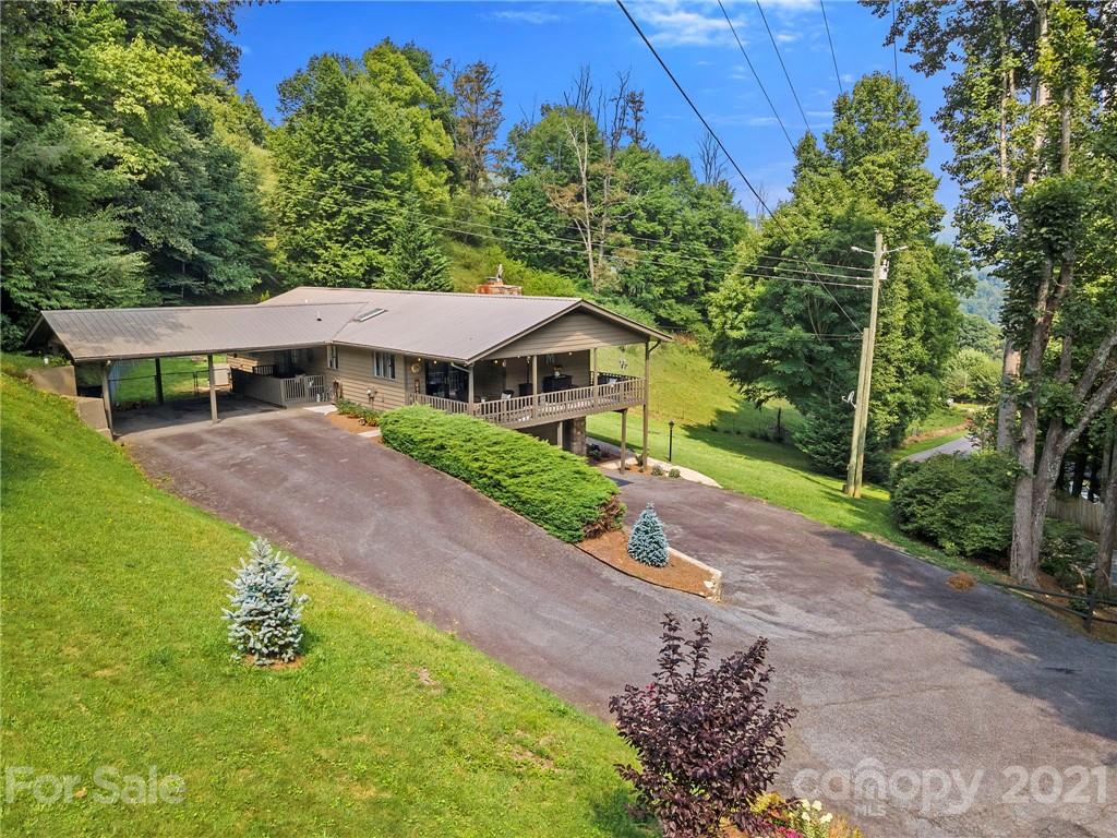 1004 Lickstone Road Waynesville, NC 28786 - Photo 36 of 39 a house with trees in the background