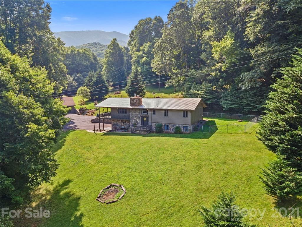 1004 Lickstone Road Waynesville, NC 28786 - Photo 39 of 39 a view of a house with a swimming pool