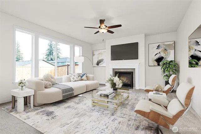 a living room with furniture a fireplace and a flat screen tv
