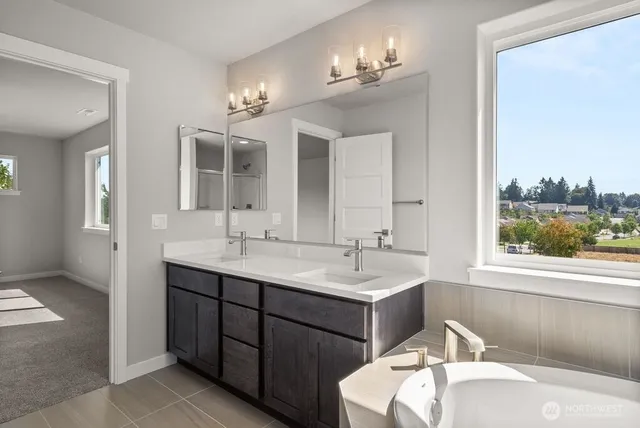 a bathroom with a double vanity sink and a mirror
