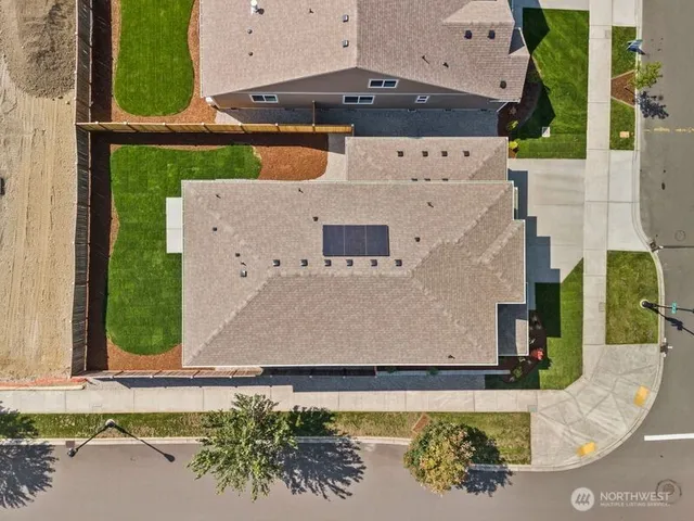 an aerial view of a house with a swimming pool