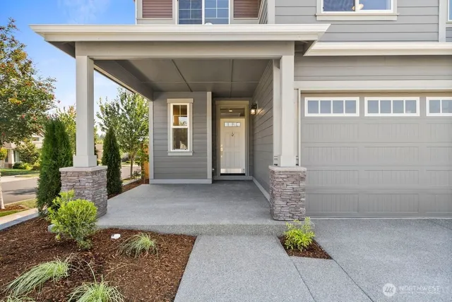 a view of a house with potted plants