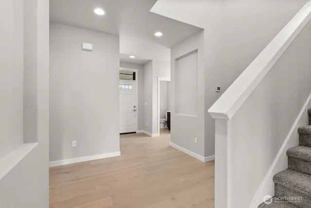 a view of a hallway with hallway and stairs