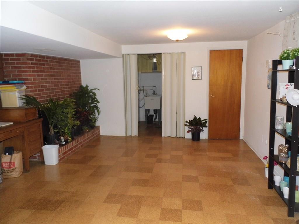 111 South Jamestown Road Coraopolis, PA 15108 - Photo 11 of 12 LOWER LEVEL GAMEROOM - W/LOGBURNING FIREPLACE, POWDER RM & ACCESS TO LAUNDRY