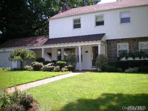 5 Ridge Road Searingtown, NY 11507 - Photo 1 of 1 a front view of house with yard and green space
