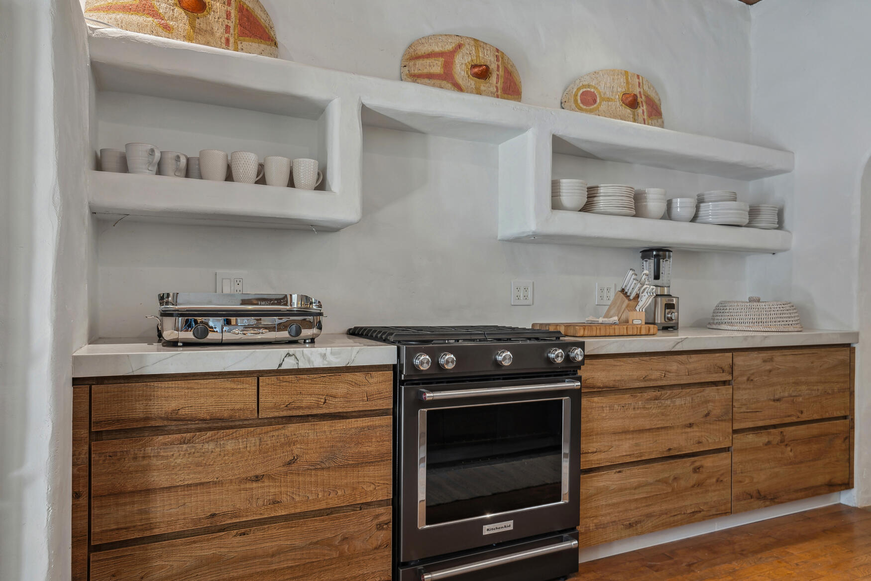 71607 Sahara Road Rancho Mirage, CA 92270 - Photo 18 of 118 a kitchen with stainless steel appliances granite countertop a stove and a wooden floor