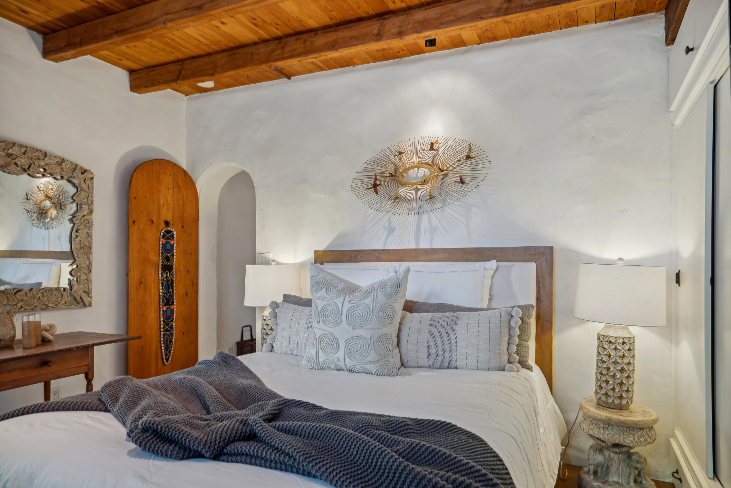 71607 Sahara Road Rancho Mirage, CA 92270 - Photo 38 of 118 a spacious bedroom with a bed and a chandelier