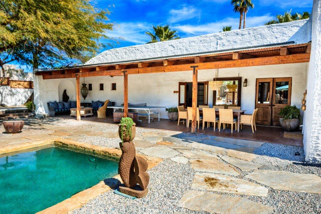 71607 Sahara Road Rancho Mirage, CA 92270 - Photo 65 of 118 a view of a patio with swimming pool table and chairs