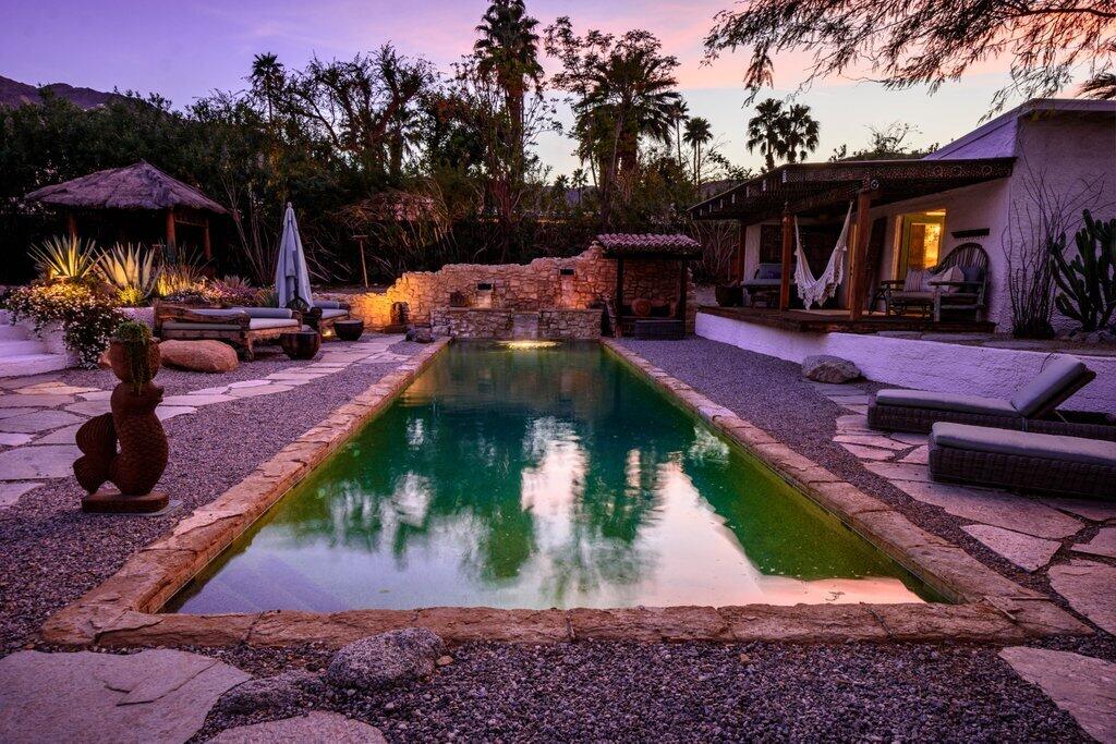 71607 Sahara Road Rancho Mirage, CA 92270 - Photo 94 of 118 a swimming pool with outdoor seating yard and barbeque oven