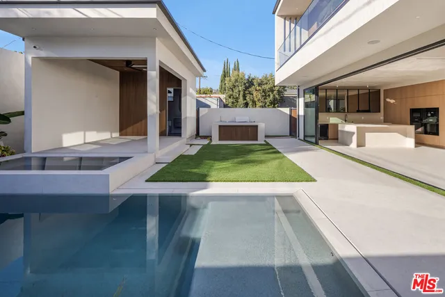 a view of living room kitchen with a table and chairs