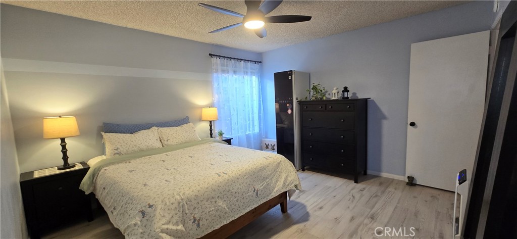 6830 Astoria Drive Riverside, CA 92503 - Photo 17 of 23 a bedroom with a bed and a walk in closet
