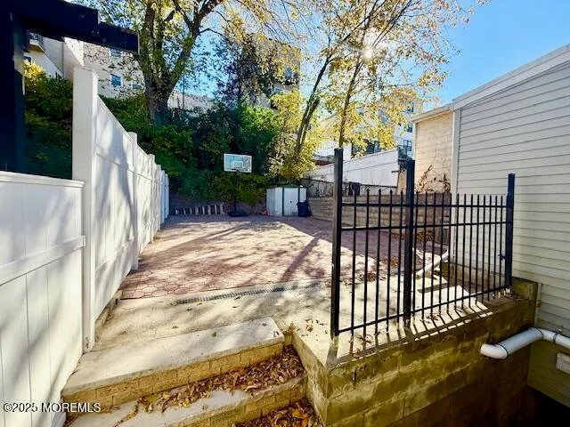 a view of a wrought iron fences in front of house