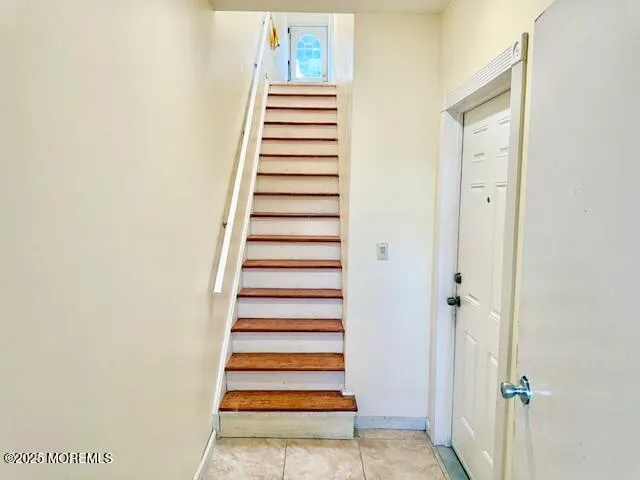 a view of a hallway with stairs
