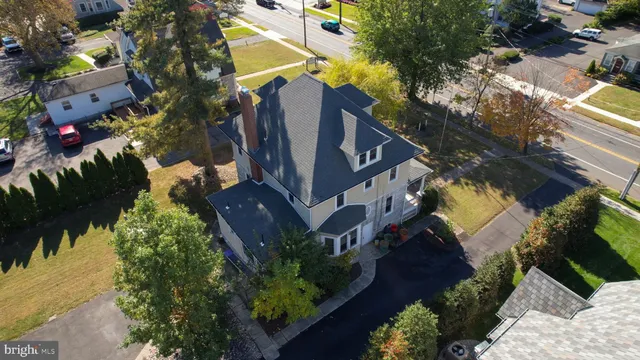 a living room with hard wood floors and a window