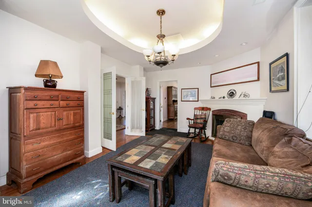 a bathroom with a toilet a sink and a mirror