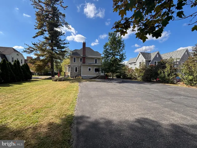 an aerial view of houses with outdoor space