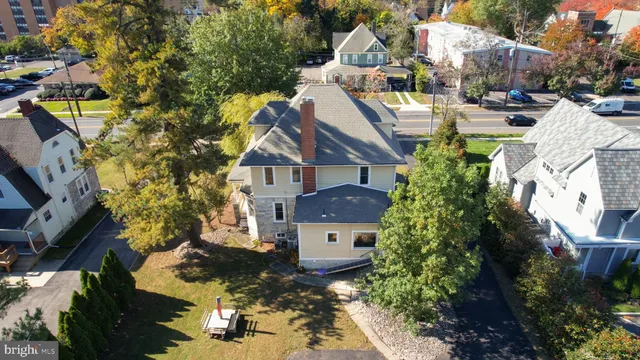 an aerial view of residential house with outdoor space and swimming pool