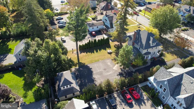 an aerial view of a house with a yard and garden
