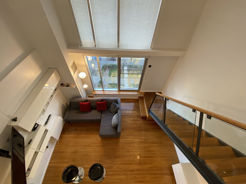 a view of entryway with furniture and rug