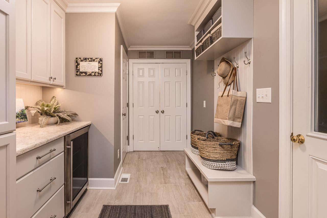 4200 Oak Park Road Raleigh, NC 27612 - Photo 11 of 30 Mudroom with Laundry Closet & Half Bath