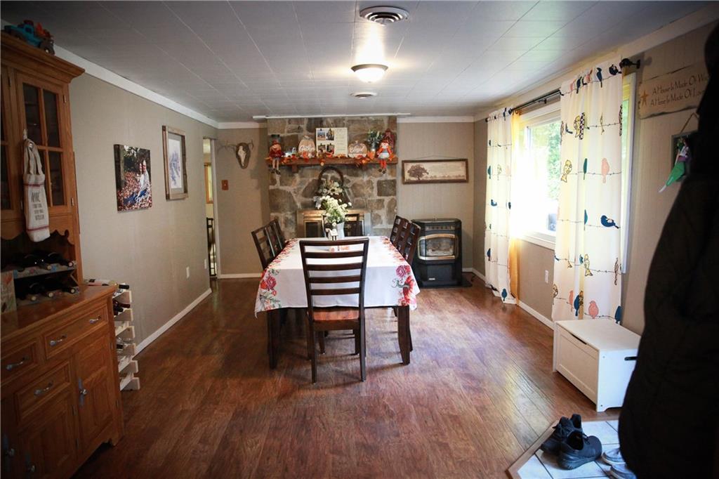 75 Spruce Peak Road Acme, PA 15610 - Photo 11 of 25 a room with furniture a flat screen tv and a window