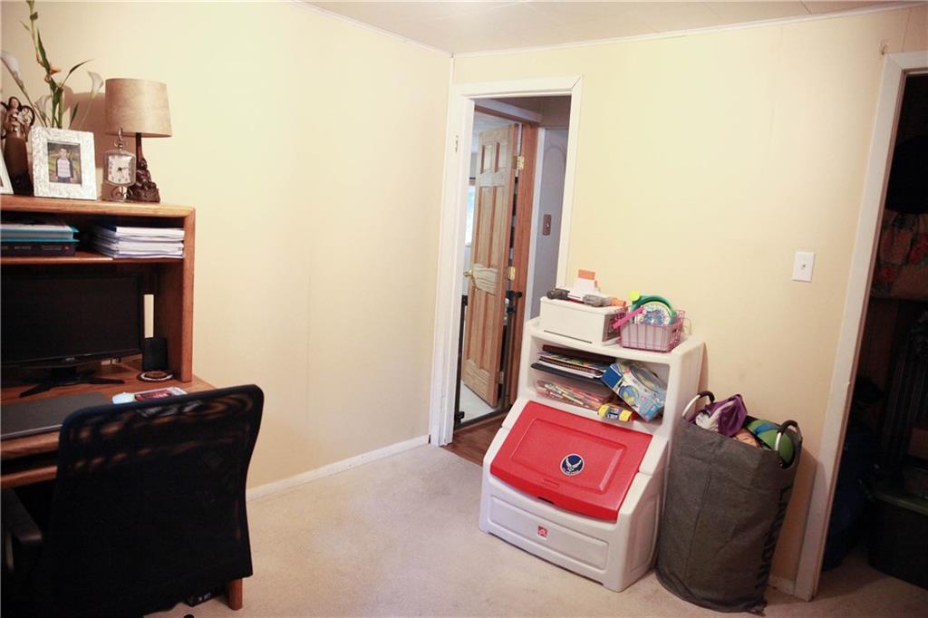75 Spruce Peak Road Acme, PA 15610 - Photo 20 of 25 a bedroom with a bed and flat screen tv
