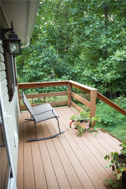 75 Spruce Peak Road Acme, PA 15610 - Photo 3 of 25 a balcony view with two chairs and a table