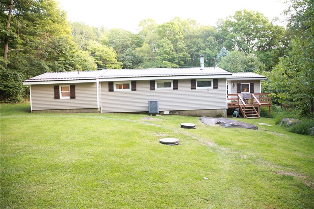 75 Spruce Peak Road Acme, PA 15610 - Photo 4 of 25 a view of a house with a big yard