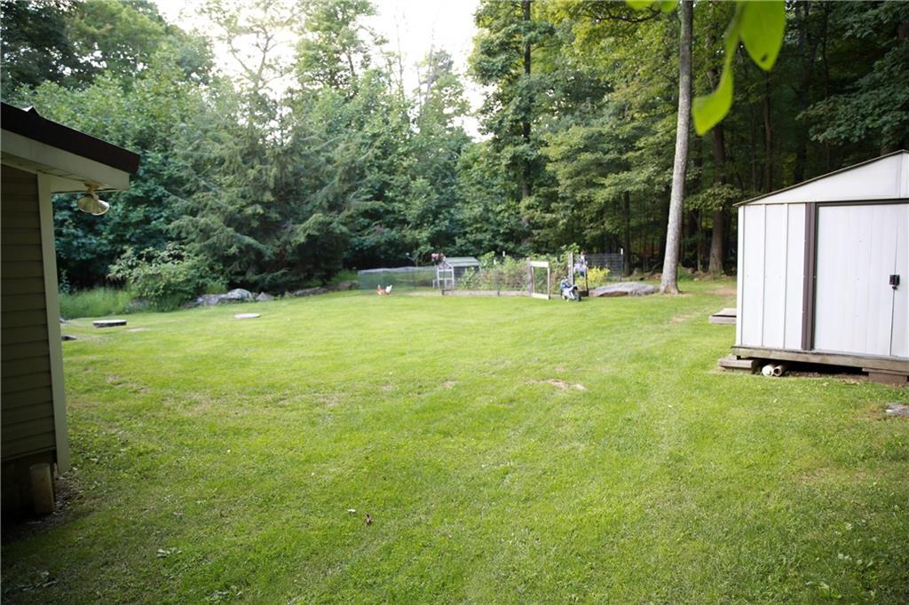 75 Spruce Peak Road Acme, PA 15610 - Photo 6 of 25 a view of a field with a tree