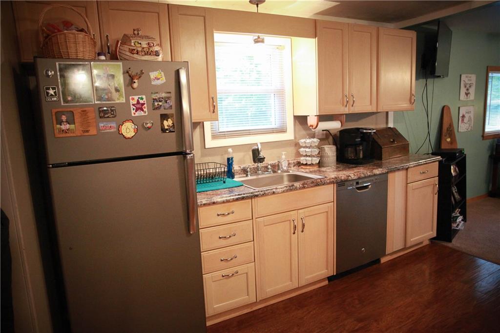 75 Spruce Peak Road Acme, PA 15610 - Photo 10 of 25 a kitchen with stainless steel appliances a refrigerator sink and cabinets