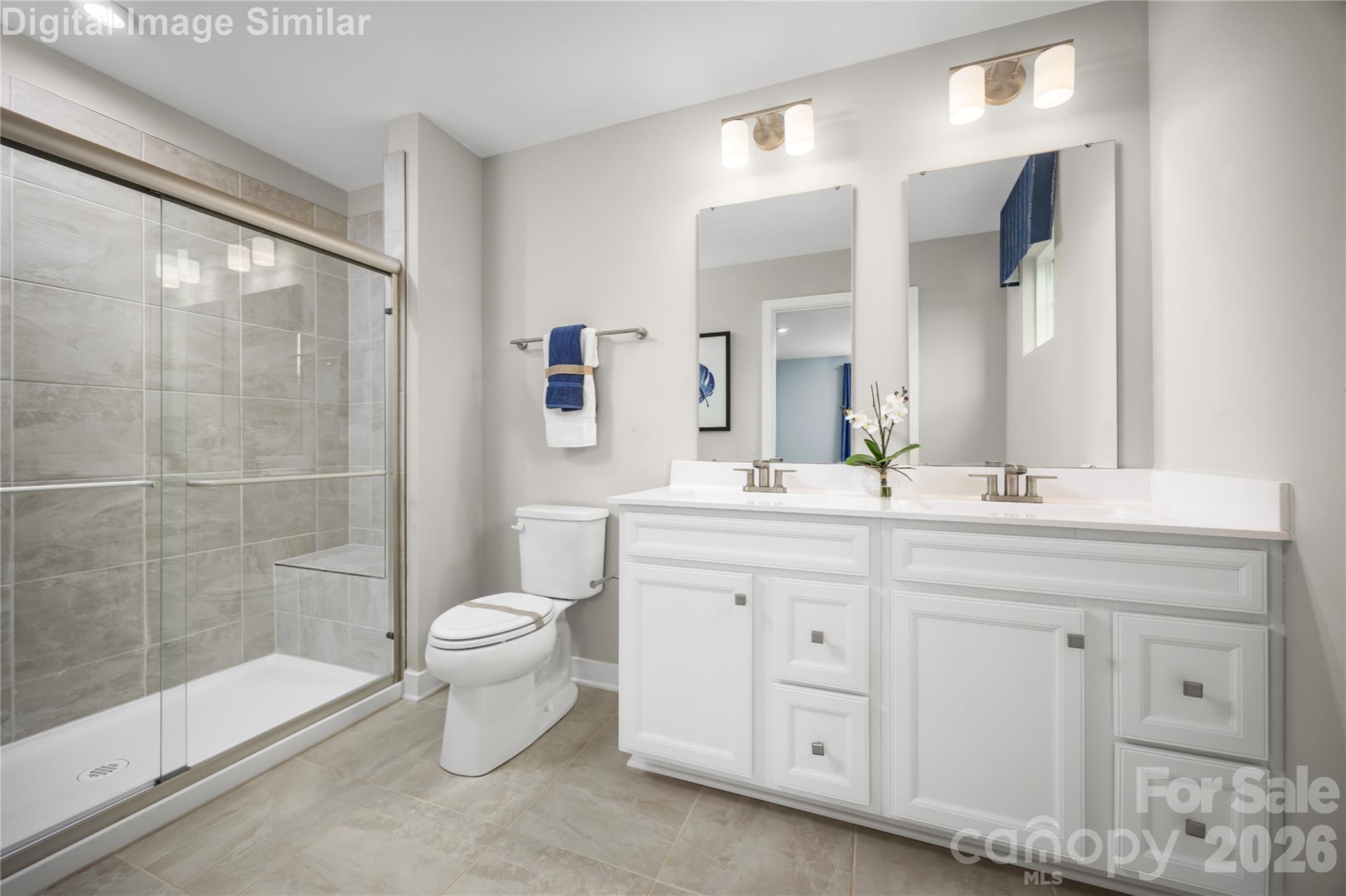 3290 Eller Drive Extension Hickory, NC 28602 - Photo 11 of 21 a bathroom with a double vanity sink toilet and shower