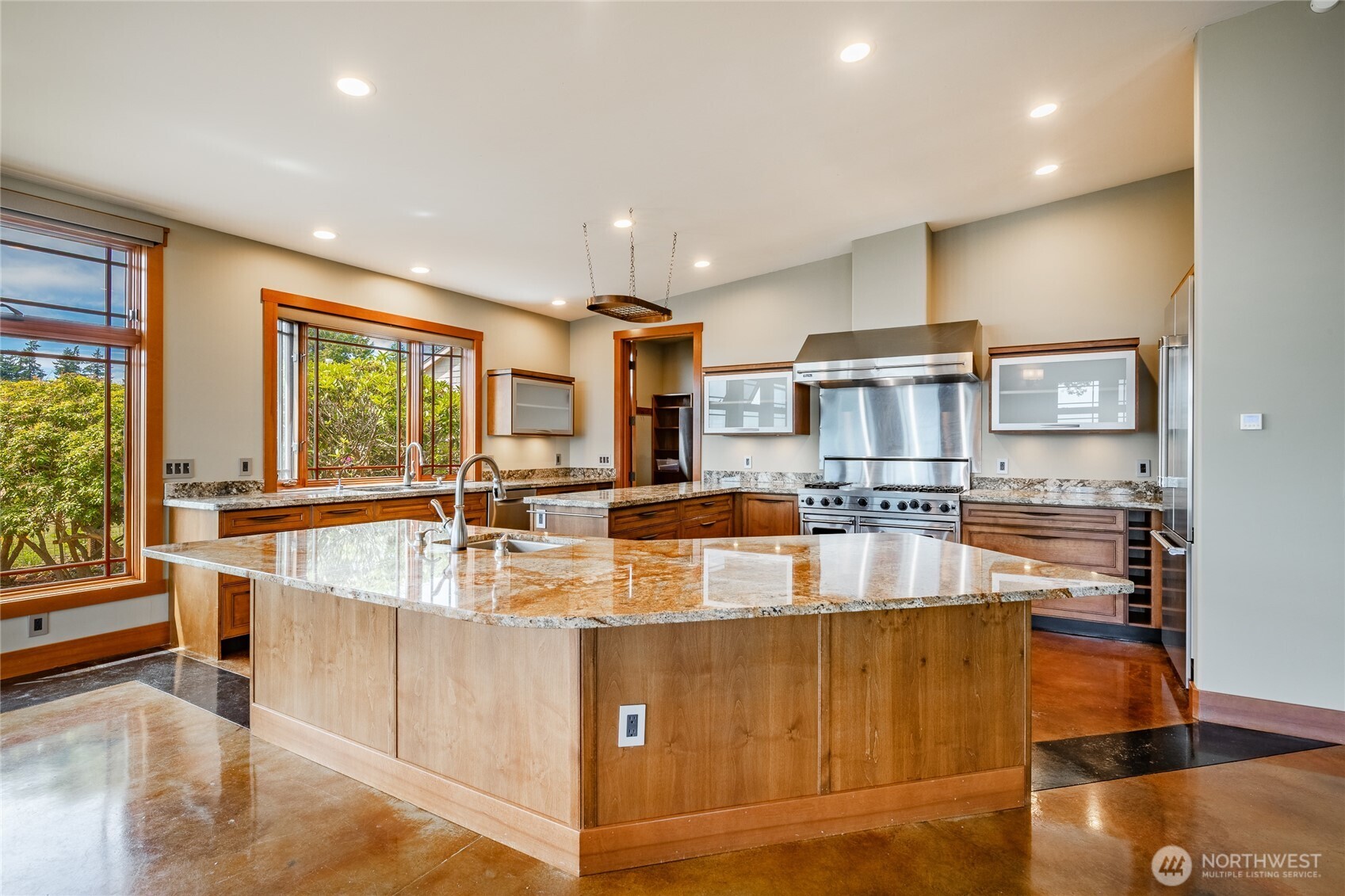 5727 Nakat Way Blaine, WA 98230 - Photo 13 of 37 a large kitchen with kitchen island a large window