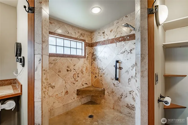 a bathroom with a shower toilet and a shower curtain