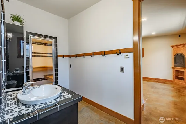 a bathroom with a sink and a mirror