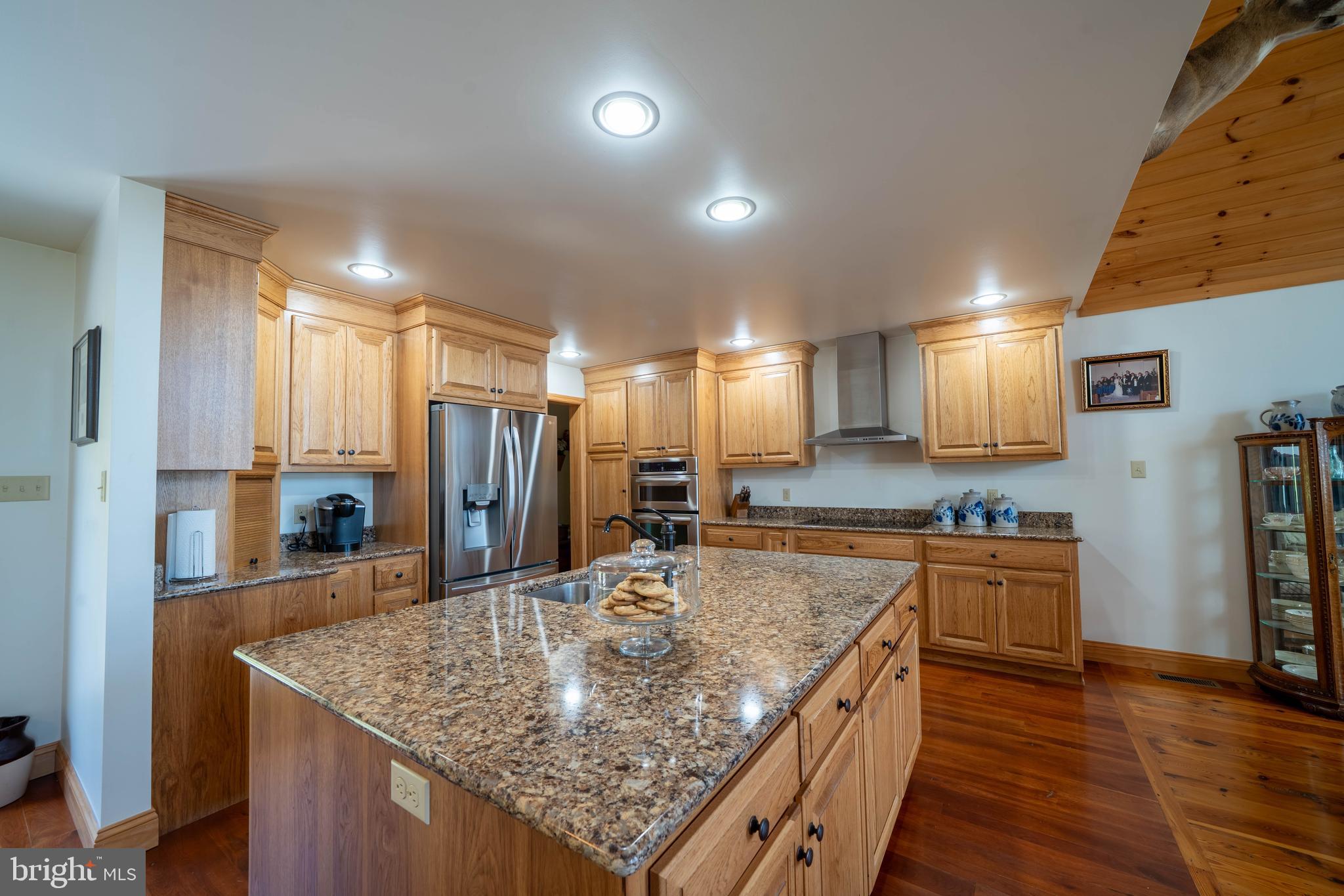 1020 Clark Hill Road Mount Pleasant Mills, PA 17853 - Photo 52 of 76 a kitchen with stainless steel appliances granite countertop a kitchen island a stove and a sink