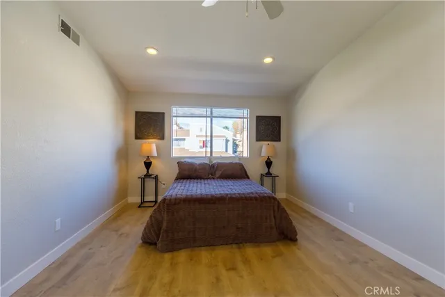 a bedroom with a bed and window