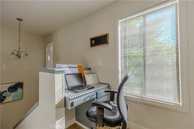 a work room with furniture and a window