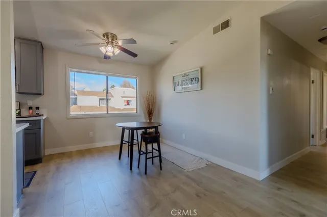 a view of a livingroom with furniture window and wooden floor